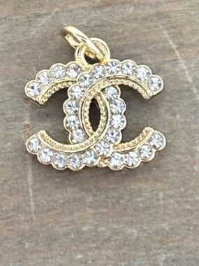 CHANEL button zipper pull, gold tone and clear rhinestones